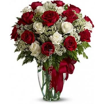 Valentine Red and White Roses in a clear glass Vase decorated beautifully. 30 Red and White 