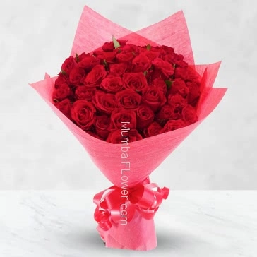Stunning Bunch of 75 Red Roses nicely decorated with fillers and ribbons, packed with exclusive Red Paper Packing