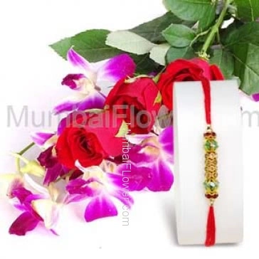 1pc Rakhi with 2 Orchids and 5 Red Roses with fillers ribbons. Please note : Rakhi Design / Basket / Boxes /  Container may be replaced in case of unavailability/out of stock.