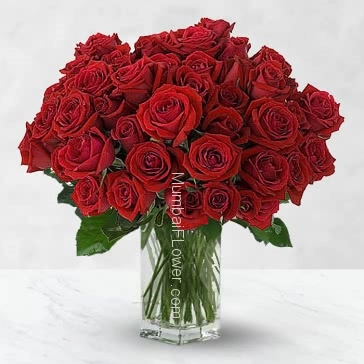 Wishes for a sweet and love filled Valentines Day! Glass Vase with 40 Valentine Red Roses.