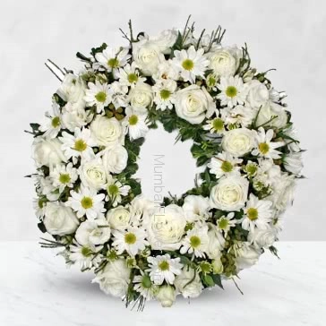 With heartfelt condolences.With deepest sympathy.

Wreath Sympathy Flowers