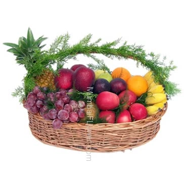 A basket of mixed fruits with foliage beautifully decorated a devine gift.