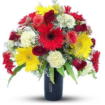 Mixed Exotic Flowers in a Simple Glass Vase beautifully arranged. 15 Mixed Colored Roses, 15 Mixed Colored Carnation and 15 Mixed Colored Gerberas