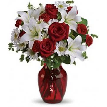 Valentine Red Roses and White Lilies in a Clear Simple Glass Vase a wonderful arrangement. 10 Red Roses, 10 White gerberas and 4 PC Asiatic White Lilies 