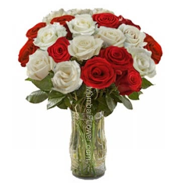 30 Valentine Red and White Roses in a Clear Glass Vase beautifully decorated.