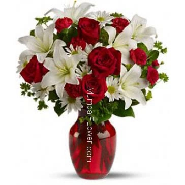 Beautiful arrangement of white lilies and Red roses in a clear glass vase. 20 Roses and 6 PC Asiatic White Lilies