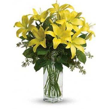 Wonderful 10 pc Asiatic Yellow Lilies in a Glass Vase.
