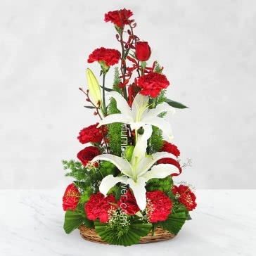A unique arrangement of 10 Red Roses 10 Red Carnation and 2 pc Asiatic White Lilies nicely decorated with fillers and greens for any occasion.