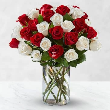 Classically fantastic way to say I love you whith these special 30 Red and White Roses in a Vase nicely decorated with fillers