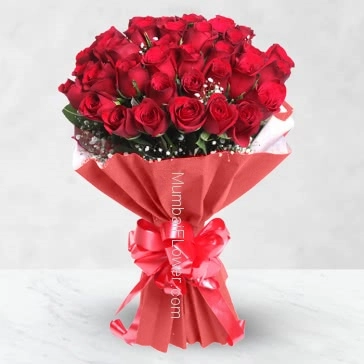 Bunch of 50 Red Roses nicely decorated with fillers and ribbons. Express your love to your Special Valentine.
