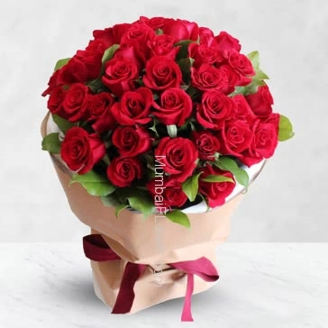 Bunch of 40 Red Roses nicely decorated with filler and ribbons and packed with Paper Packing.