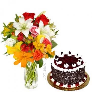 Glass Vase with 10 Mixed Colored Roses, 4 Mixed Colored Lilies nicely decorated with 1 kg. Black fores cake 