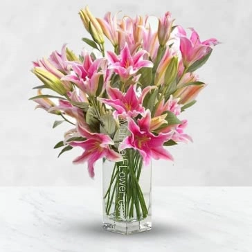 Bunch of 5 Stems of pc Pink Oriental lilies nicely decorated with fillers and greens.. please note: Glass Vase is not included 