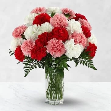 Glass vase with 30 pink red and white carnation nicely decorated with fillers and greens