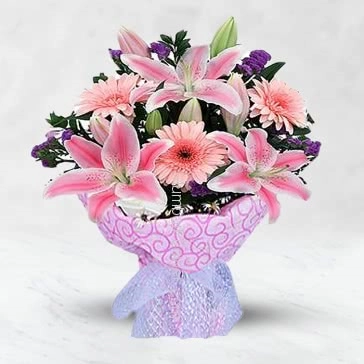 Bunch of 3 pc Asiatic pink lilies and 10 pink gerberas nicely decorated with fillers and ribbons...paper packing