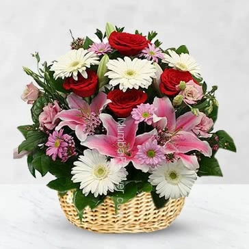 Basket of 15 red roses 15 white gerberase and 3 pc Asiatic pink lilies nicely decorated with fillers and ribbons.