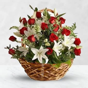 Basket of 5 pc Asiatic white lilies and 20 red roses nicely decorated with greens
