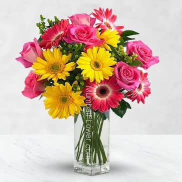 Glass vase with 25 Mixed roses and gerberas nicely decorated with greens