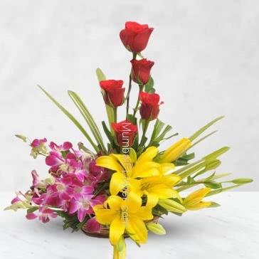 Arrangement of 5Pc Purple Orchids, 3pc Asiatic Yellow Lilies and 10 Red Roses with fillers and greens