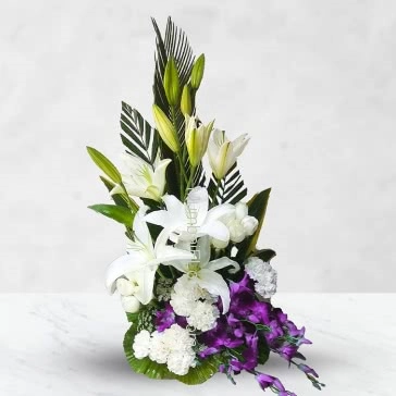 Arrangement of 10 White carnation, 10 white Roses, 3 PC Asiatic White Lilies and 6 PC  Orchids with fillers and greens. <b>Please note:</b> we may substitute color in case of unavailability 