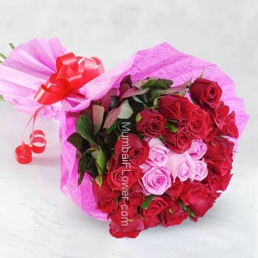 Romantic and lovely Hand Bunch of 30 mix Red and Pink Roses nicely decorated with colored Paper Packing and Ribbons