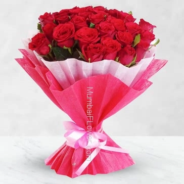 Hand Bouquet of 30 Red Roses nicely decorated with fillers ribbons and exclusive paper packing, come fall in love.