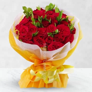 Stunning Hand Bouquet of 35 Red Roses nicely decorated with fillers and ribbons, packed with exclusive paper packing