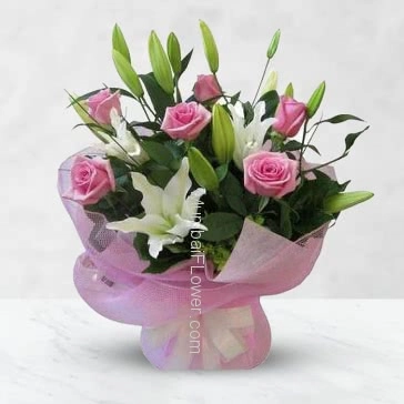 Hand Bunch of 6 Pink Roses and 2 Stems of Asiatic White lilies nicely decorated with fillers and ribbons with Color Paper Packing