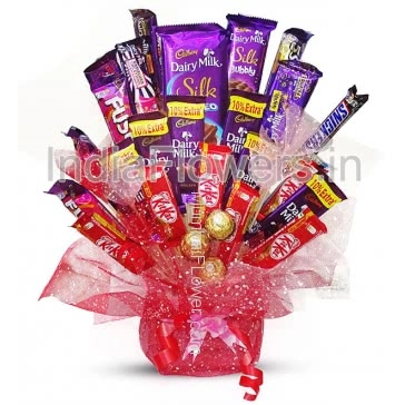 Bouquet of Mixed Chocolates, this chocolate gift contains 3pc Ferrero Rocher, 6pc Kitkats 18g., 6pc Dairy Milk 25g., 2pc Fuse 50g., 2pc Snickers 28g., 4pc Dairymilk Flavoured 36g., 1pc 5star 43g., 1pc Silk Bubbly 50g., 1pc Big Silk Chocolate Bar 137g. arranged beautifully with beautiful packing and ribbons. Please note we may substitute chocolate / flavours in case of unavailability. 