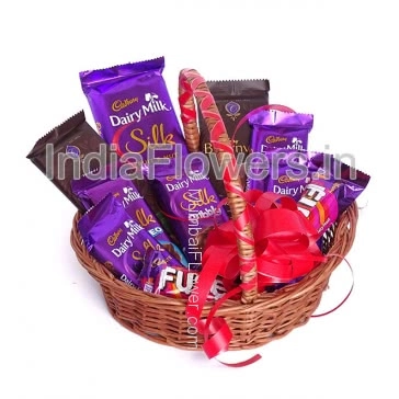 Basket of Cadbury Chocolates, contains 1 big cadbury silk 137g., 1pc Silk Bubbly 50g., 4pc Cadbury Silk 55g., 2pc Cadbury Bournville 31g., 2pc Cadbury Fuse 50g.