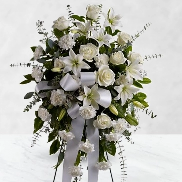 Paying respects is the proper response when someone so dear passes away. This amazing flower arrangement, carefully crafted by professional florists are of purity white full blooms, makes for a luxurious and honorable tribute.
<br>Arranged with: 
20 White Roses, 
20 White Carnation, 
8pc Asiatic White Lilies with fillers and greens decorated 
with white ribbons.
