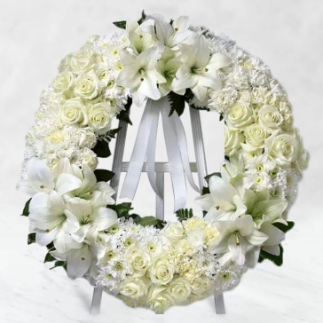 Round Wreath Arrangement of 30 White Roses, 30 White Carnations, 15 Stems of Sivanthi, 10 Stems of White Lilies with fillers and fillers and White Ribbons.. with Stand
