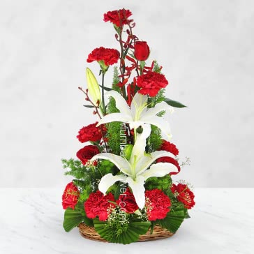 A unique arrangement of 10 Red Roses 10 Red Carnation and 2 pv Asiatic White Lilies nicely decorated with fillers and greens for any occasion.