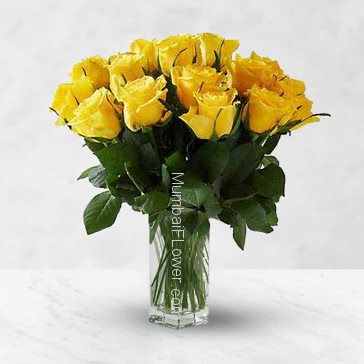 Simple Glass vase with 12 Yellow Roses nicely decorated with fillers and greens