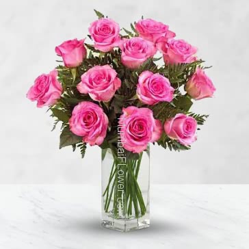 Simple Glass vase with 12 Pink Roses nicely decorated with fillers and greens