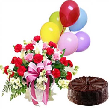 Basket of mixed flowers nicely decorated with half kg.chocolate truffle cake and simple baloons